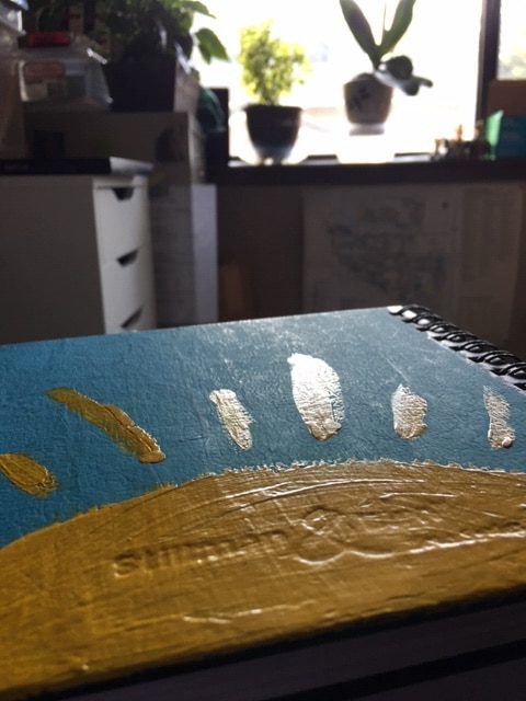 photo of Book of Grief with plants in the studio background