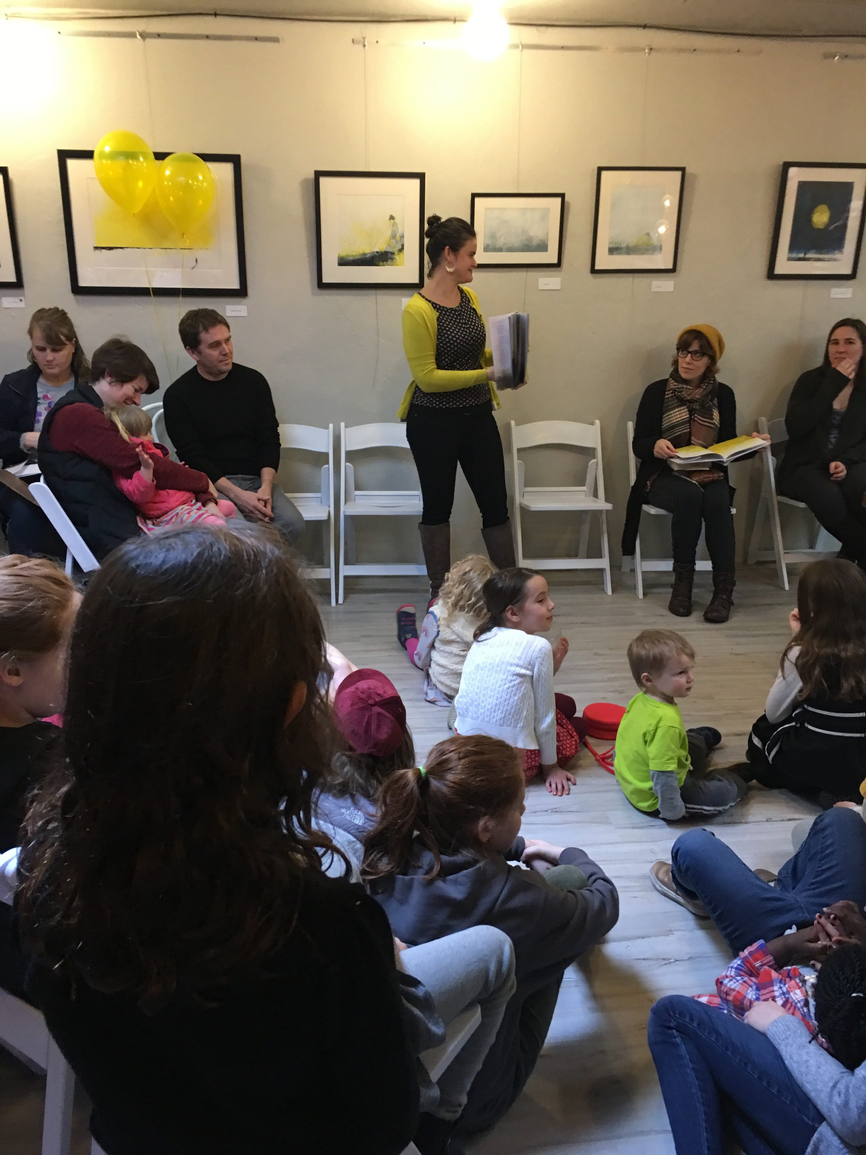 Luyken reading her book to the crowd